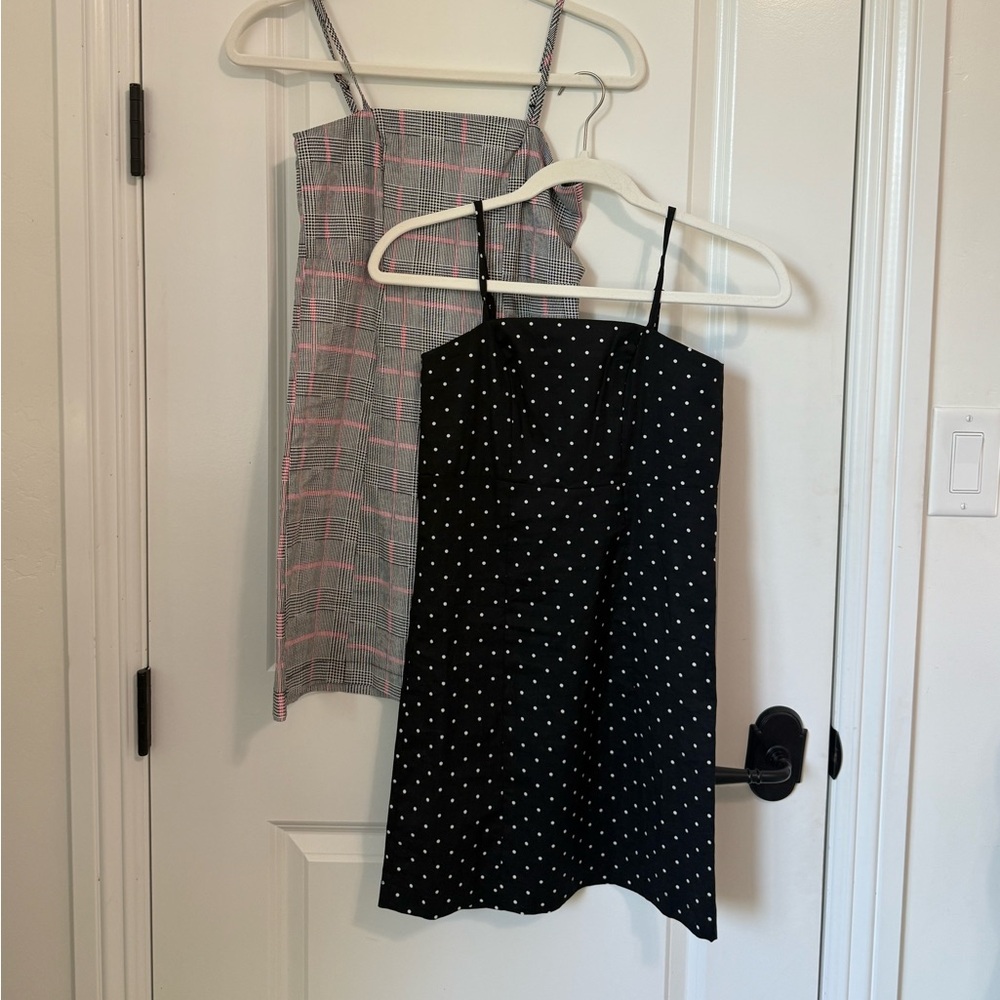 Two cute dresses- one in a plaid and one black with white polkadots.